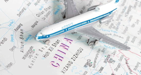 Toy airplane on map of China