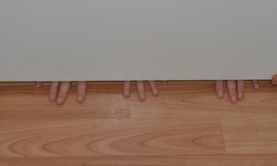 hands under door